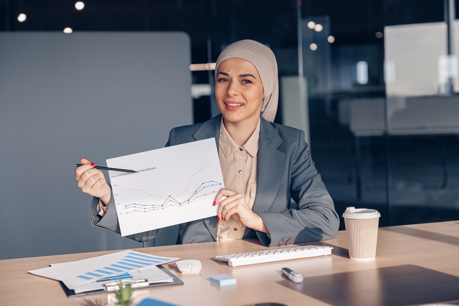 Content Optimization Tips for Maximum Impact smiling muslim businesswoman in hijab shows a grap amh74w7